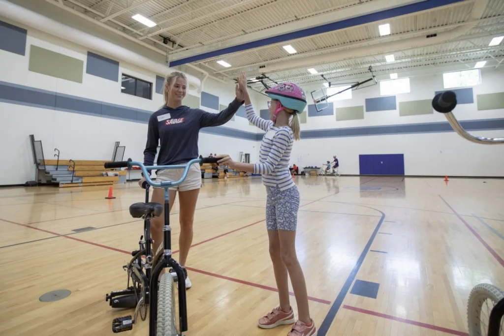 Covey volunteers in a Gymnasium